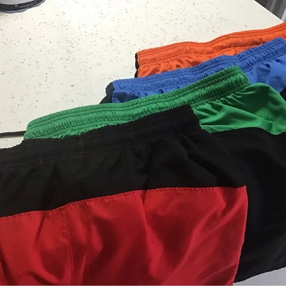Under Armour Men’s large GUC 4 pair shorts in red, green, blue, and orange - Picture 2 of 4